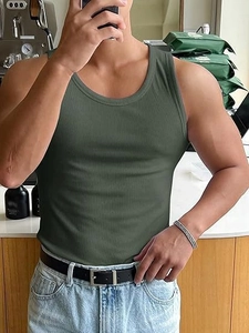 Macro shot of olive green ribbed knit texture on a slim fit men's athletic tank top