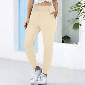 Women's high-waisted beige joggers with elastic waistband and pockets for casual wear