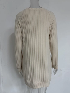 Detailed back view of light beige ribbed knit long sleeve sweater with raglan sleeves