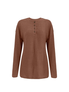 Detail of brown ribbed knit sweater featuring a buttoned Henley neckline and drop shoulders
