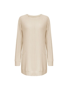 Detailed macro view of the beige ribbed knit texture and front pockets on a long sleeve shirt