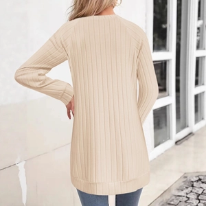 Women's long-sleeve knit cardigan in apricot featuring vertical ribbing and raglan sleeves