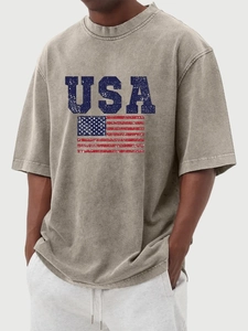 Detail of vintage washed grey-green t-shirt with distressed USA flag print