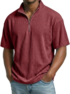 Detail of burgundy corduroy polo shirt featuring vertical texture and half-zip collar