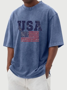 Close-up of vintage washed navy cotton fabric and distressed USA flag print on t-shirt