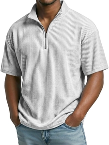 Detail of men's grey corduroy polo shirt featuring a quarter-zip and ribbed texture
