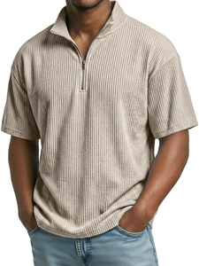 Close-up of beige corduroy polo shirt with quarter-zip detail and ribbed fabric texture