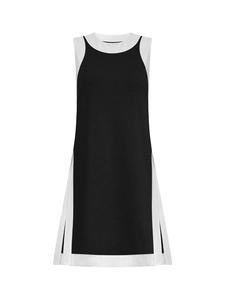 Detail shot of the side slit and layered black and white contrast hem of this tank top