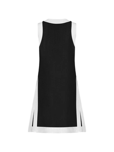 Detail of contrast color sleeveless dress featuring side slits and structured fabric