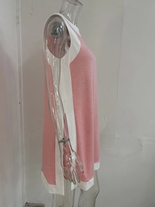 Close-up of pink and white color-block sleeveless dress with side slit design on mannequin
