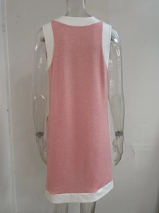Detail view of pink and white color-block sleeveless dress with high-quality knit texture
