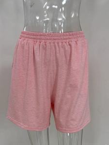Detailed close-up of pink casual shorts with elastic waistband and heather texture fabric
