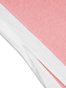 Detail of pink knitted fabric with white trim and side slit stitching on two-piece set