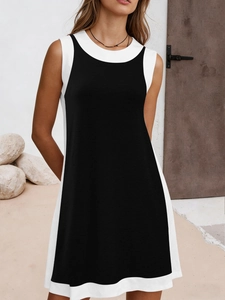 Detail view of contrast black and white stitching on a sleeveless plus size dress