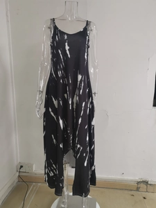Detail of black and white tie-dye dress fabric with abstract patterns and pockets