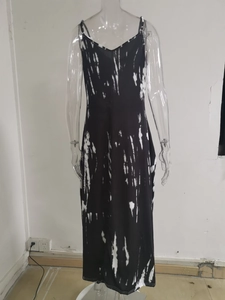Detail view of tie-dye printed dress showing thin spaghetti straps and ink-wash texture