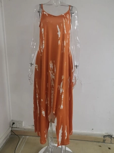 Detail of orange and white tie-dye sleeveless dress with irregular hem and side pockets