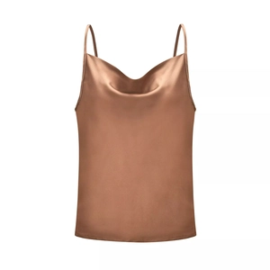 Detail view of champagne satin camisole featuring elegant cowl neck and thin spaghetti straps