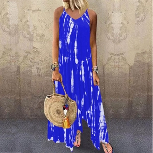Close-up of bohemian blue and white tie-dye dress with irregular hem and side pockets