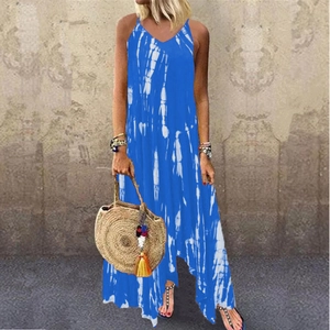 Detail of blue and white tie-dye dress featuring a V-neckline and irregular hemline