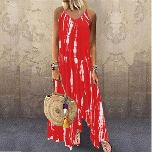 Detail of red and white tie-dye maxi dress with V-neckline and asymmetrical slit hem