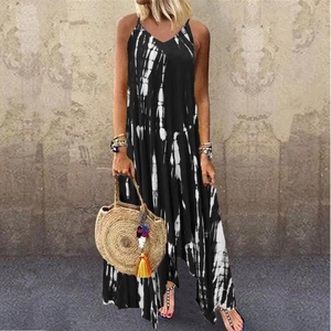 Detail of bohemian summer dress with deep V-neck and black and white tie-dye patterns