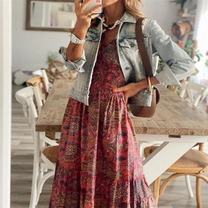 Detail of red paisley bohemian maxi dress with cinched waist and tiered skirt