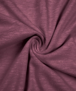 Close-up of plum purple knit fabric with slub texture showing soft drape and material