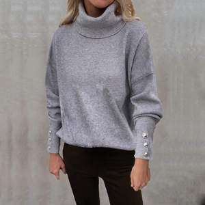 Chic light grey turtleneck ribbed sweater with silver button cuffs and loose fit style