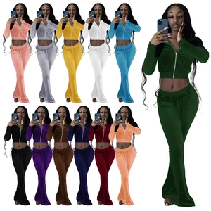 Women velvet tracksuit set showing crop zip hoodie and flared pants in eleven various colors