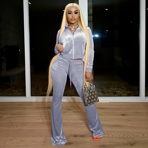 Detail of lavender velvet two-piece tracksuit with cropped zip-up jacket and flare pants