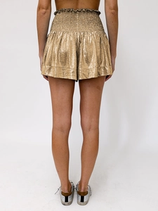 Detail of metallic champagne gold wide-leg shorts with pleated elastic waistband
