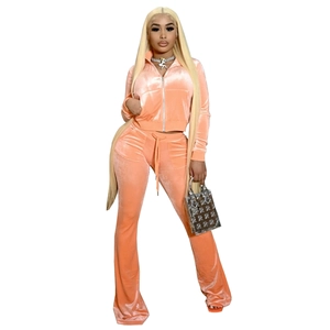 Detail of coral velvet two-piece tracksuit with zip-up jacket and flared pants