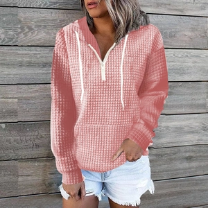 Women's coral pink waffle knit hoodie with half-zip and front kangaroo pocket