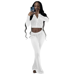 Detail of white velvet two-piece tracksuit with zip-up hoodie and high waist flare pants