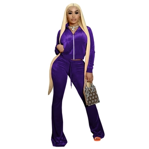 Detail of purple velvet two-piece sportswear set with zip-up jacket and flare pants
