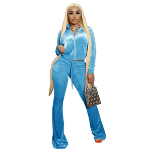 Detail of sky blue velvet tracksuit with zip-up jacket and flared drawstring trousers