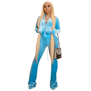 Detail of sky blue velvet tracksuit set featuring zip-up cardigan and flared pants