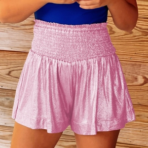 Detail view of pink metallic high waisted shorts with smocked elastic waistband