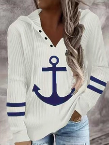 Detail of white ribbed hoodie with navy anchor print and buttoned V-neck collar
