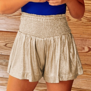 Detail of high waisted metallic gold sequined shorts with elastic pleated waistband