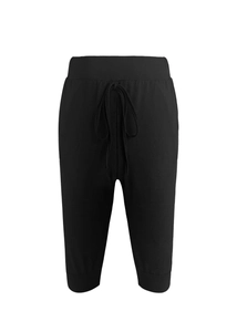 Detail view of the drawstring waist and ribbed cuffs on black yoga cropped pants