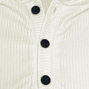 Close-up of white ribbed knit fabric with three black buttons on a long sleeve hoodie