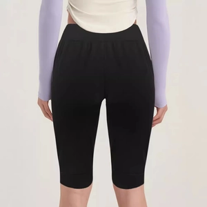 Women's high waisted black yoga shorts with slim fit design for athletic workout sessions