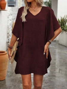 Detailed view of the V-neck and ruffle sleeves on this burgundy summer cotton dress