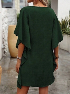 Back view of dark green loose summer dress with flutter sleeves and ruffled details