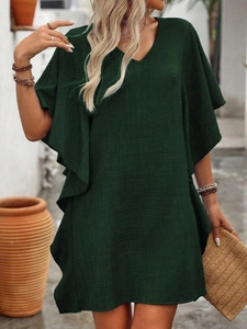 Detail of dark green V-neck dress showing ruffled flutter sleeves and linen texture