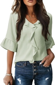 Close-up of V-neck ruffle trim and pleated flare sleeves on a light green chiffon blouse