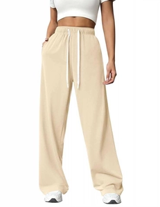 Detail of high waisted wide leg joggers featuring elastic waistband and drawstring