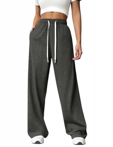 Close-up of elastic waistband with white drawstring on dark grey wide-leg lounge pants